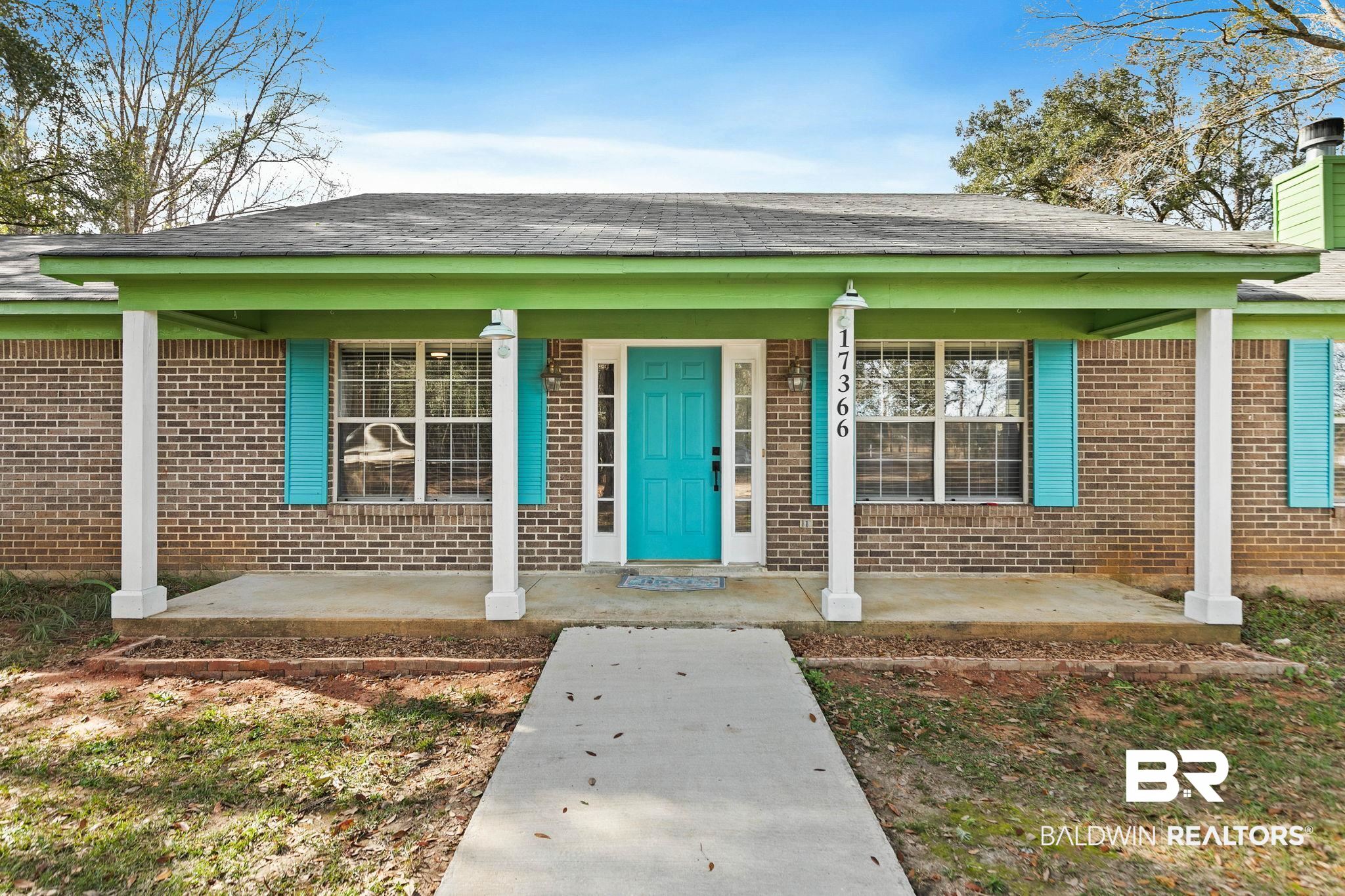 17366 Old Brady Road Bay Minette, AL 36507 - Photo 5 of 43 Property entrance featuring covered porch, brick siding, a shingled roof, and a chimney