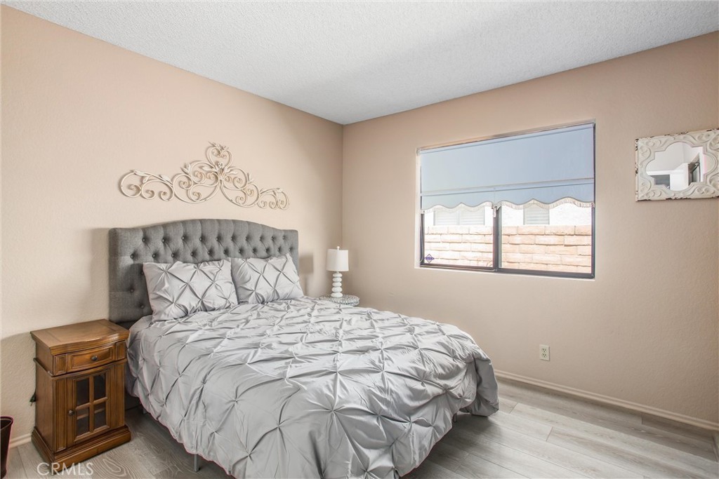 1125 Vía Nice Redlands, CA 92374 - Photo 23 of 50 a bedroom with a bed and a window