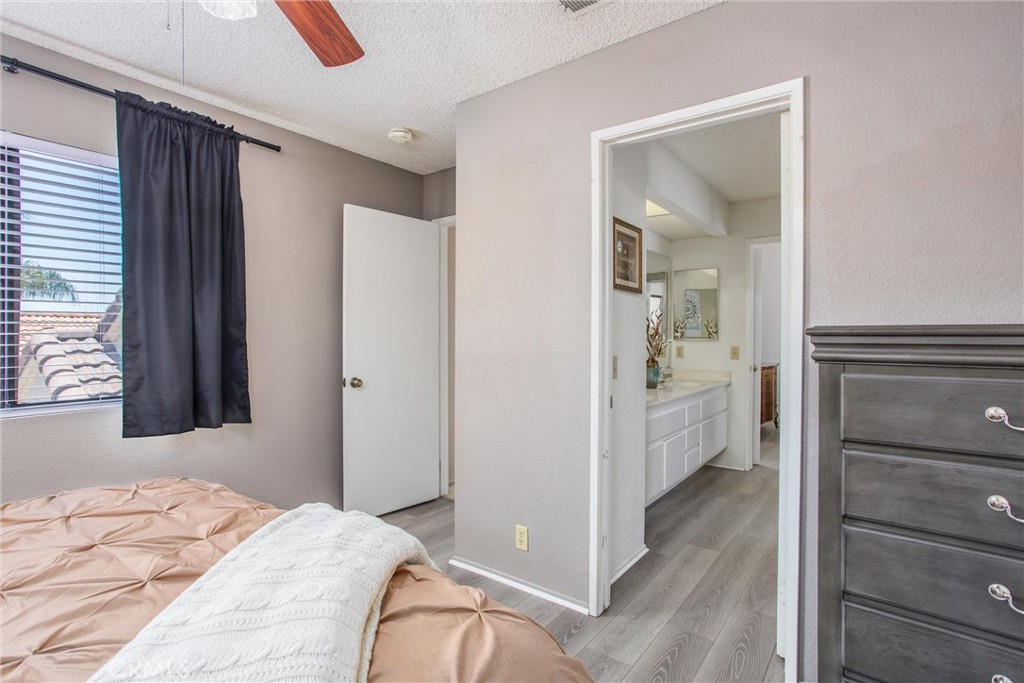1125 Vía Nice Redlands, CA 92374 - Photo 29 of 50 a bedroom with a bed and a mirror