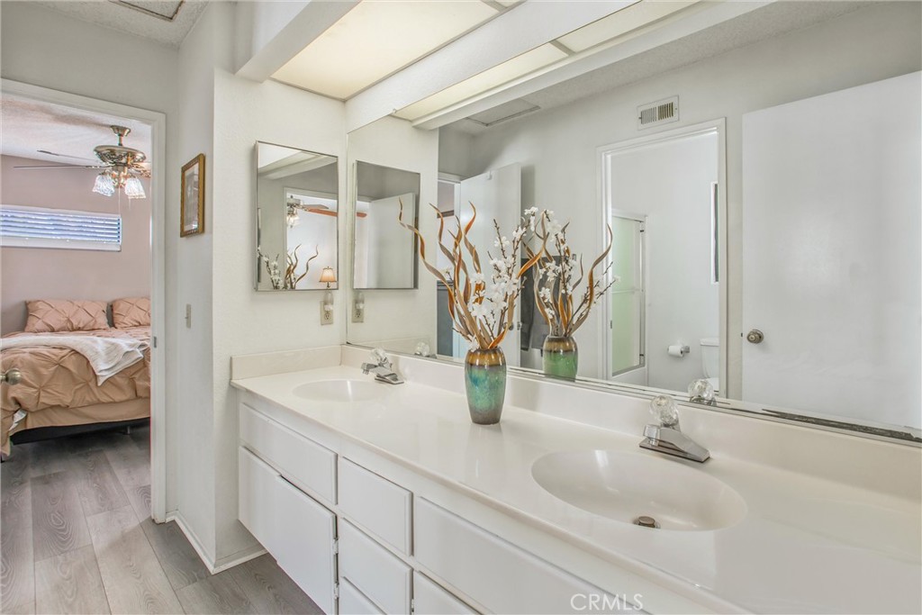 1125 Vía Nice Redlands, CA 92374 - Photo 30 of 50 a en suite bathroom with double sink and a mirror