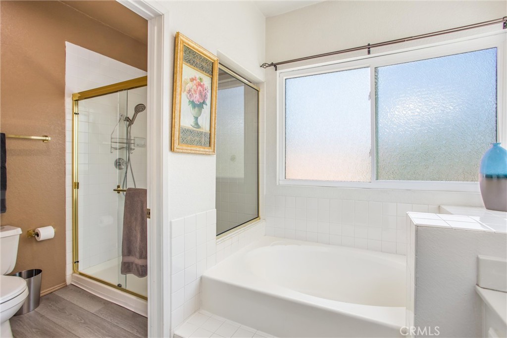 1125 Vía Nice Redlands, CA 92374 - Photo 38 of 50 a bathroom with a bathtub and a shower