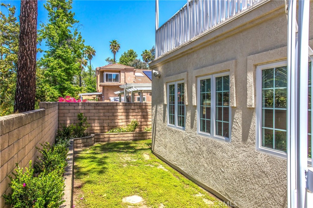 1125 Vía Nice Redlands, CA 92374 - Photo 45 of 50 a view of a swimming pool with potted plants