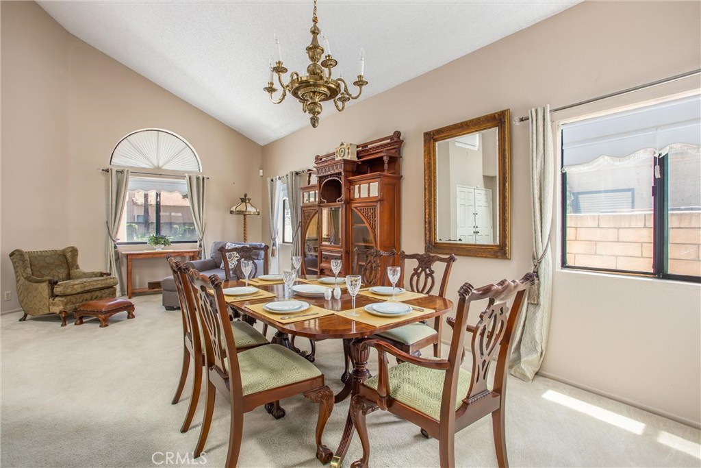 1125 Vía Nice Redlands, CA 92374 - Photo 9 of 50 a view of a dining room with furniture and a chandelier