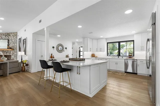 a swimming pool with outdoor seating and yard