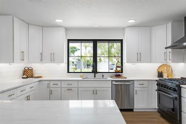 a spacious bedroom with a bed and a window