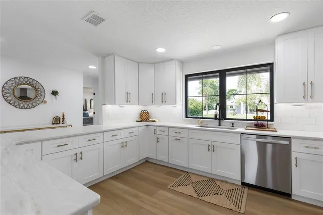 a spacious bathroom with a double vanity sink mirror and shower