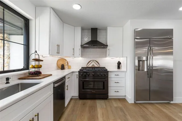 a bathroom with double vanity sink and a mirror