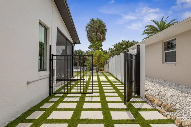 an aerial view of house with yard swimming pool and outdoor seating