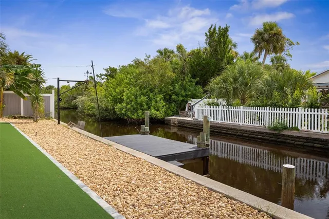 an aerial view of a residential houses with outdoor space and street view