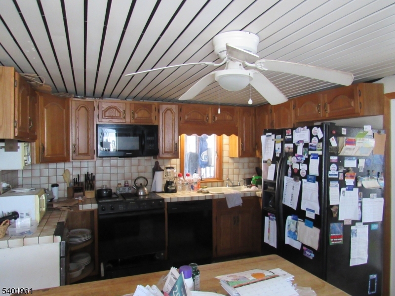 97 Hickory Corner Road Milford, NJ 08848 - Photo 4 of 14 a kitchen with a sink and cabinets