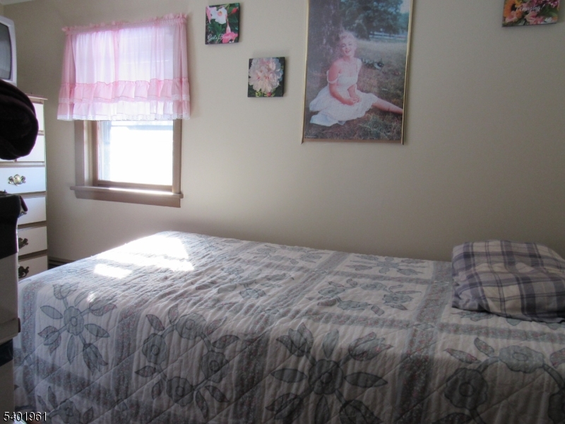 97 Hickory Corner Road Milford, NJ 08848 - Photo 10 of 14 a bedroom with a bed and a window