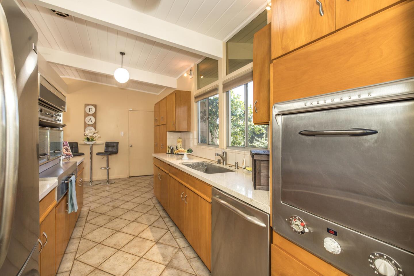 1619 Celeste Drive San Mateo, CA 94402 - Photo 20 of 44 a bathroom with a double vanity sink a mirror and a shower