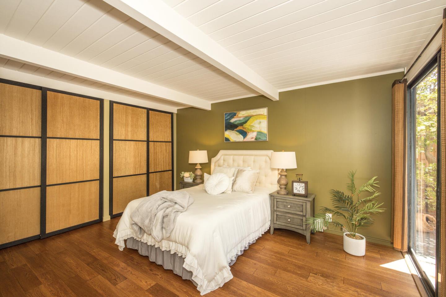 1619 Celeste Drive San Mateo, CA 94402 - Photo 22 of 44 a bed sitting in a spacious bedroom next to a window