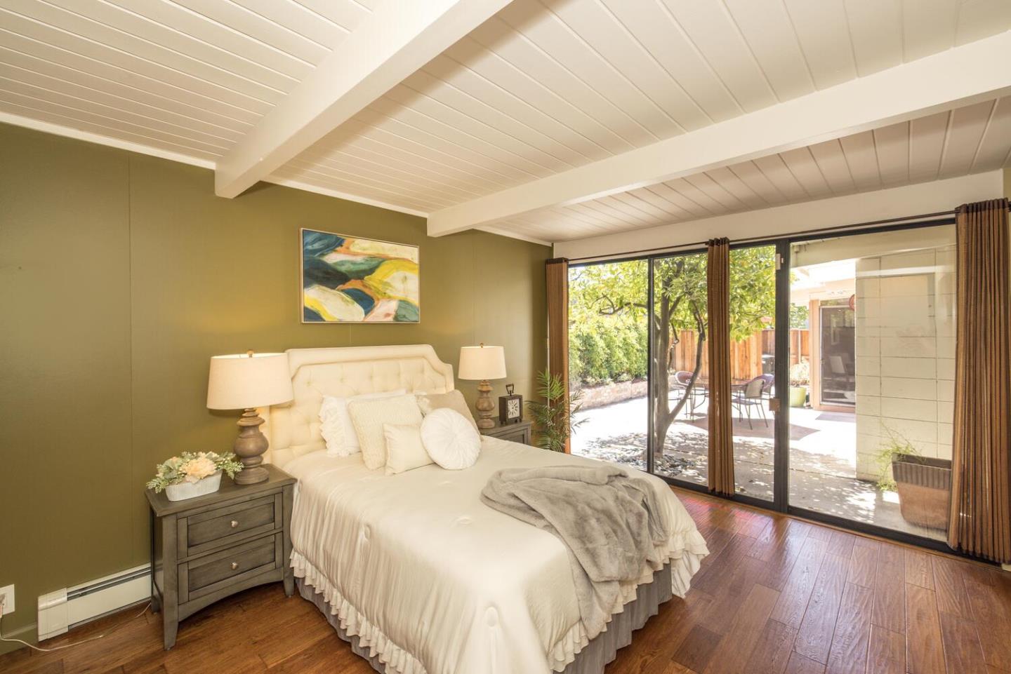 1619 Celeste Drive San Mateo, CA 94402 - Photo 23 of 44 a bedroom with a bed and a large window