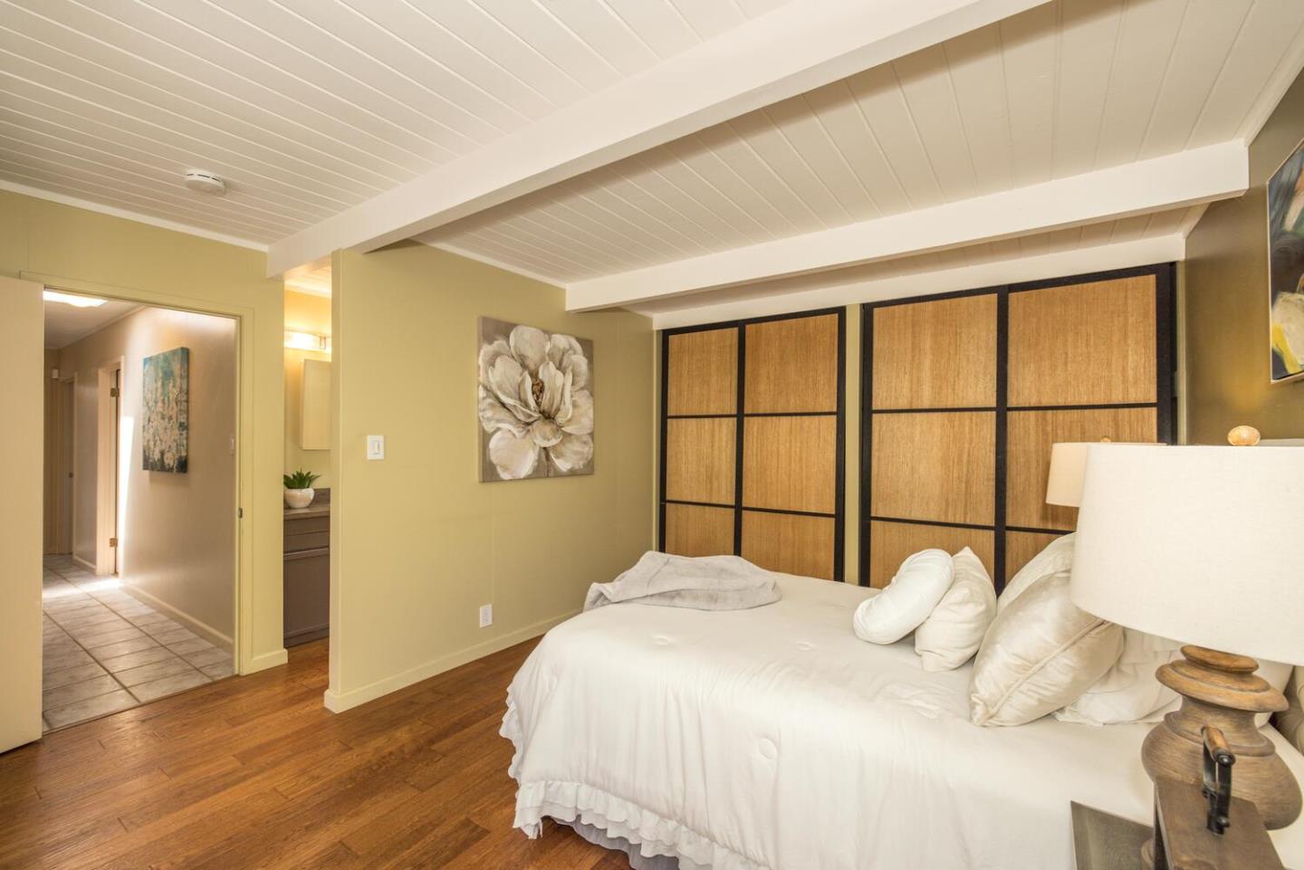 1619 Celeste Drive San Mateo, CA 94402 - Photo 24 of 44 a bedroom with a bed and a window