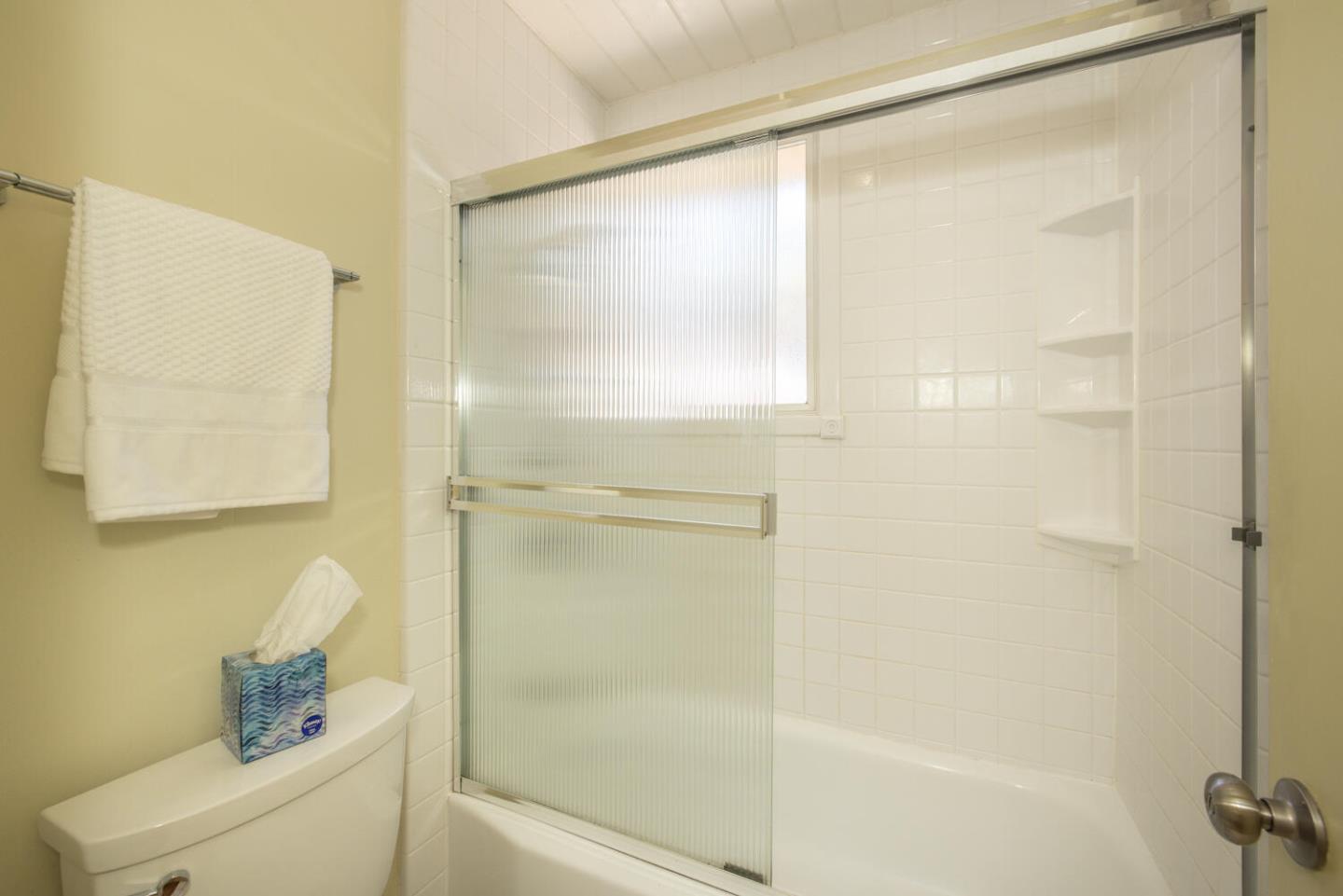 1619 Celeste Drive San Mateo, CA 94402 - Photo 26 of 44 a bathroom with a bathtub and a shower