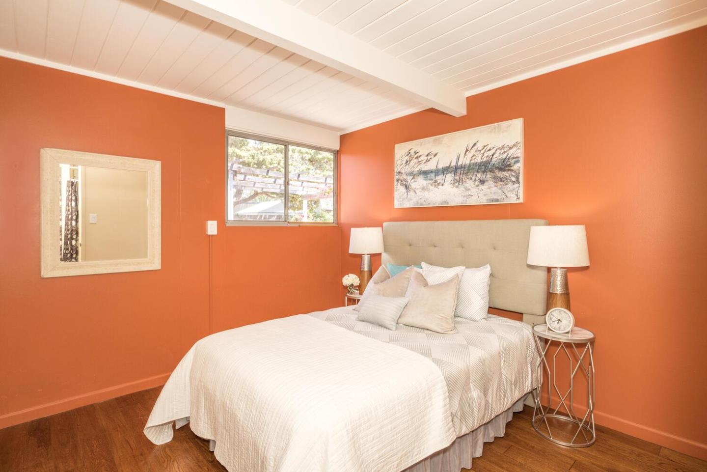 1619 Celeste Drive San Mateo, CA 94402 - Photo 27 of 44 a bedroom with a bed and a night stand