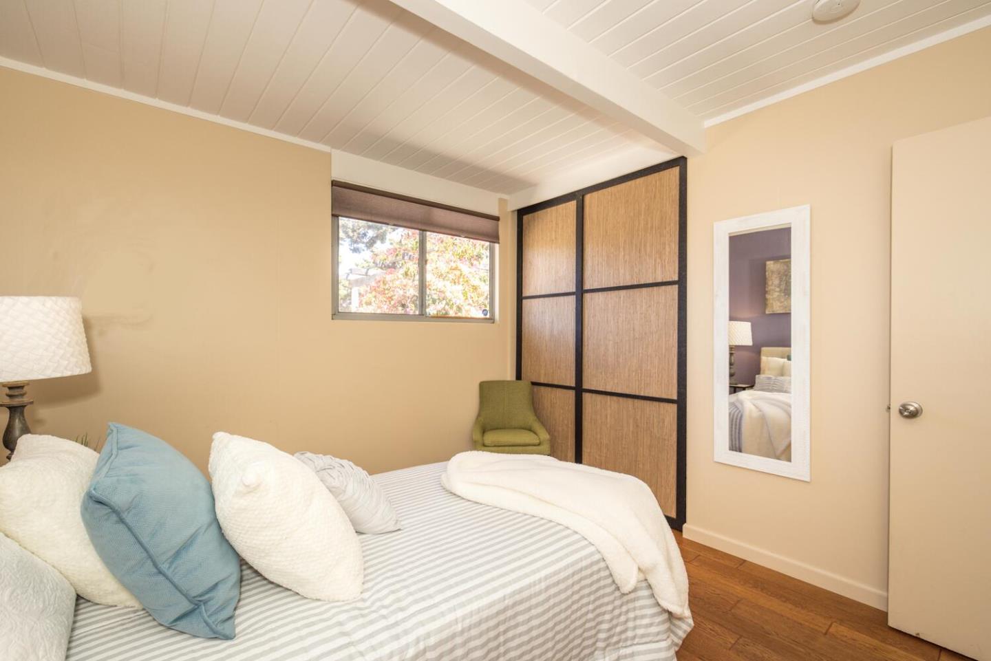 1619 Celeste Drive San Mateo, CA 94402 - Photo 30 of 44 a bedroom with a bed and a window