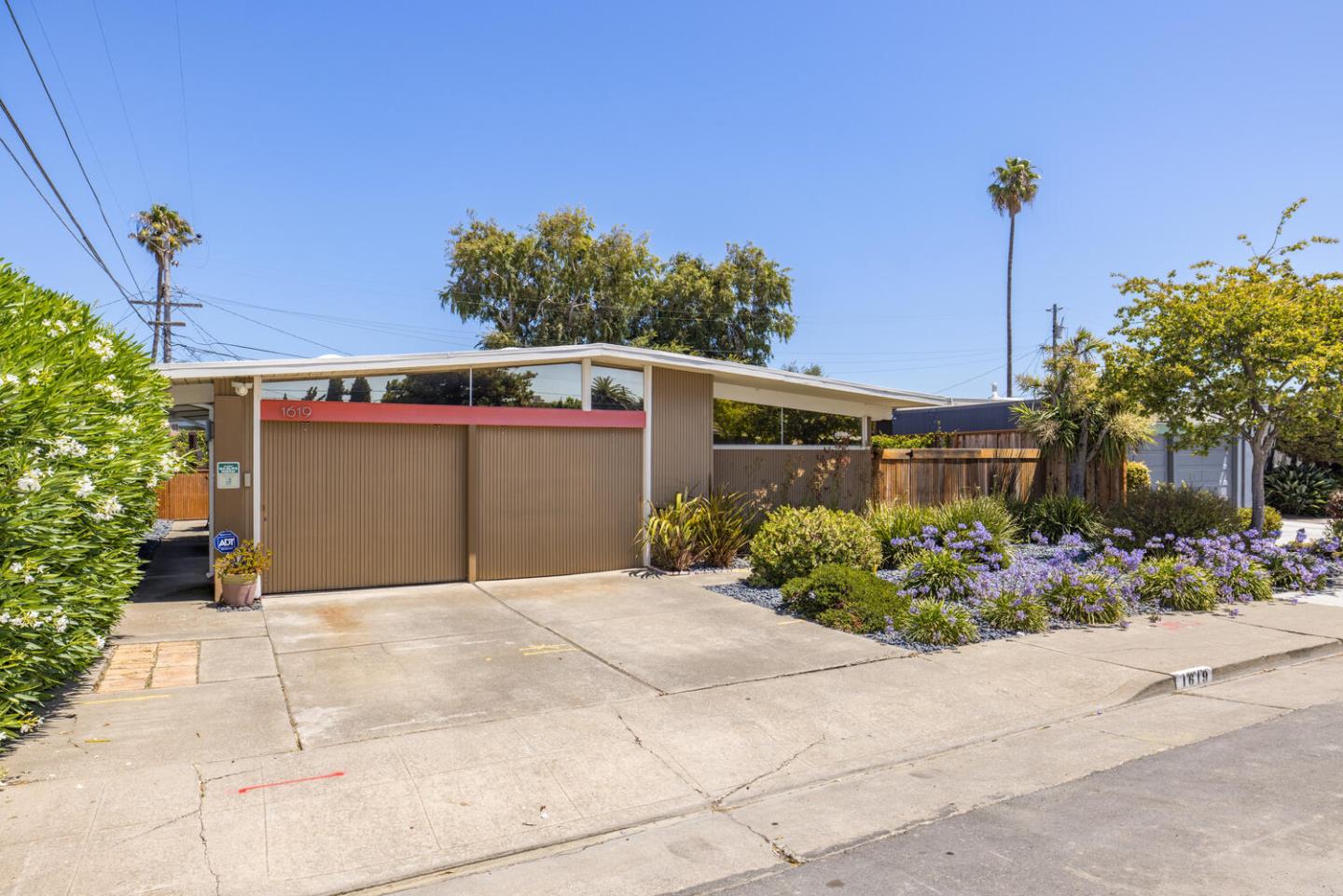 1619 Celeste Drive San Mateo, CA 94402 - Photo 4 of 44 a front view of a house with garden
