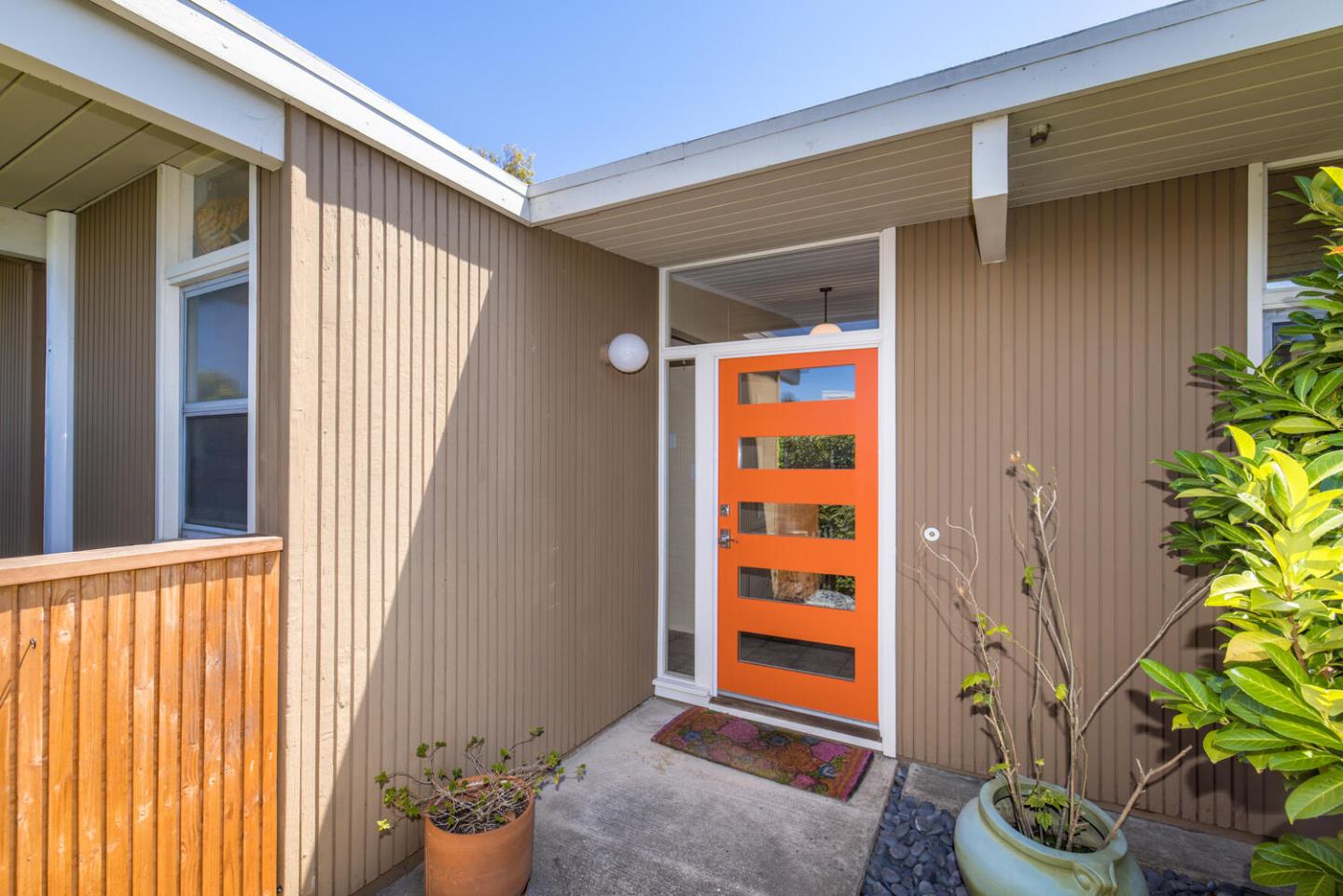 1619 Celeste Drive San Mateo, CA 94402 - Photo 5 of 44 a front view of a house with a potted plant and a window