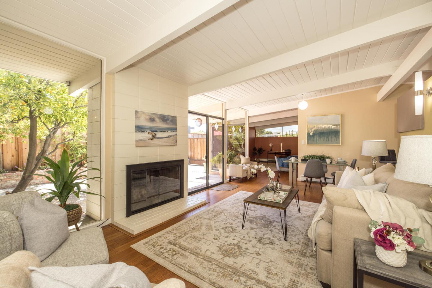1619 Celeste Drive San Mateo, CA 94402 - Photo 7 of 44 a living room with furniture fireplace and window
