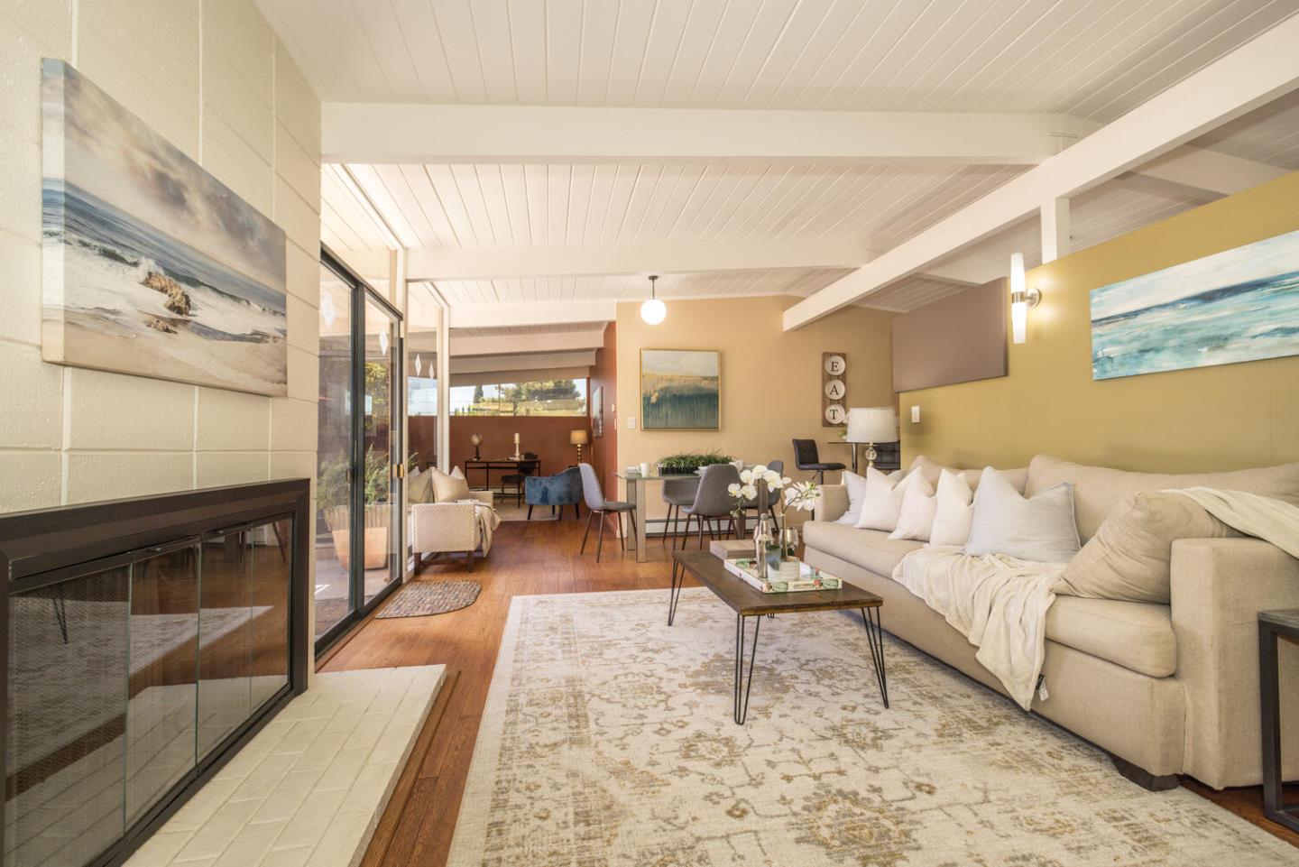1619 Celeste Drive San Mateo, CA 94402 - Photo 8 of 44 a living room with furniture wooden floor and a fireplace