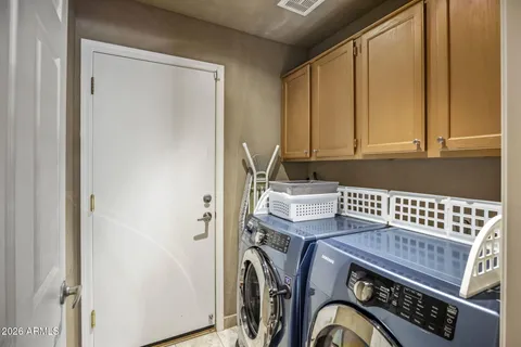 a view of storage and utility room with washer and dryer