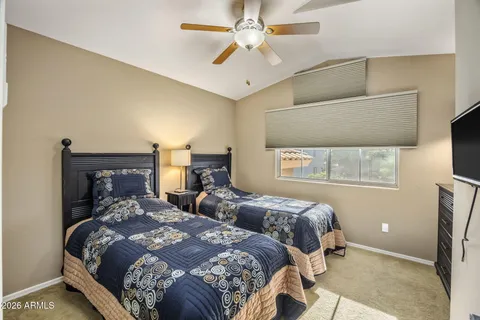 a bedroom with a bed and window