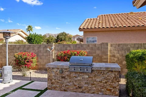 a view of a swimming pool and lounge chairs