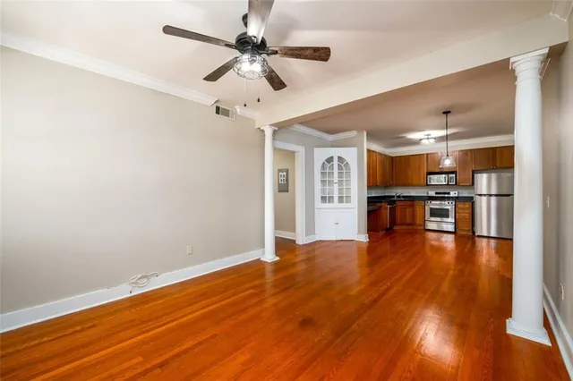 a view of kitchen with wooden floor and window
