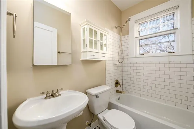 a bathroom with a sink toilet and bathtub