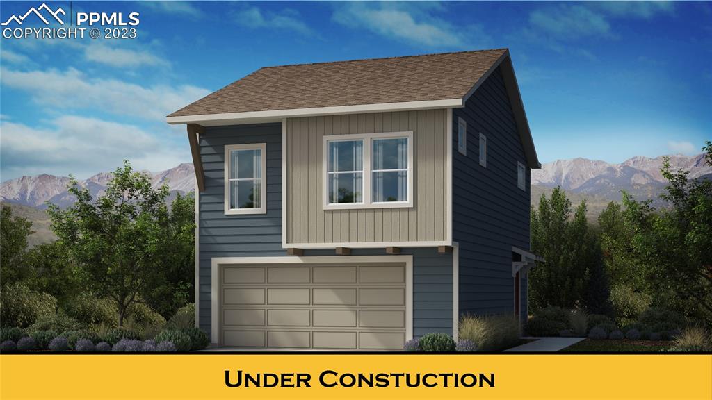2931 Magic Carpet Loop Colorado Springs, CO 80916 - Photo 1 of 13 a view of a house with a yard