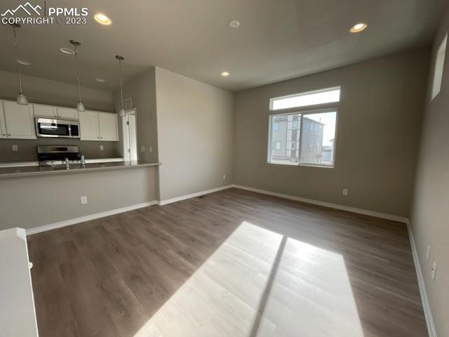 2931 Magic Carpet Loop Colorado Springs, CO 80916 - Photo 4 of 13 a view of a kitchen with a sink and a window