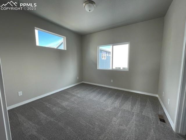 2931 Magic Carpet Loop Colorado Springs, CO 80916 - Photo 7 of 13 an empty room with a window