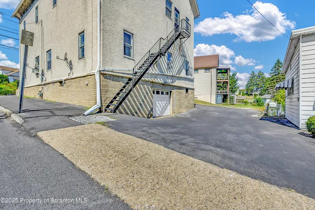 a view of a house with a street