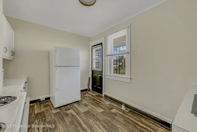 a view of livingroom with hardwood floor and hallway