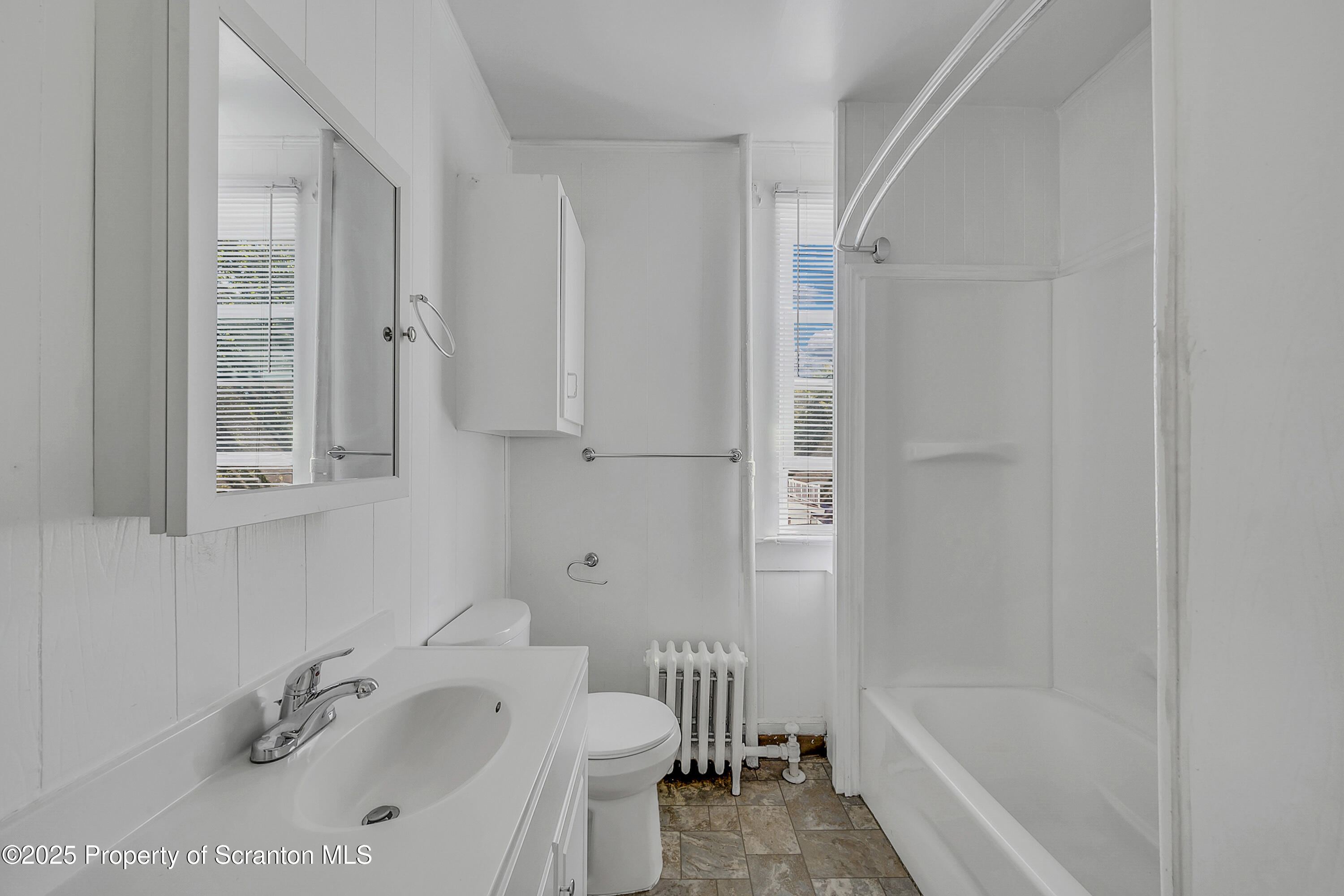 864 South Main Street, Unit 2 Old Forge, PA 18518 - Photo 8 of 14 a bathroom with a tub and a sink