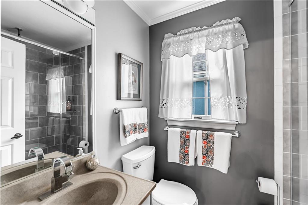199 Roscommon Place Canonsburg, PA 15317 - Photo 11 of 32 a white toilet sitting next to a bathroom sink