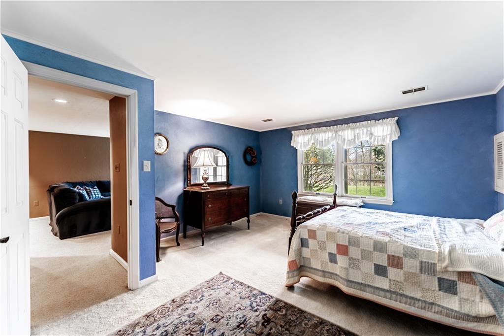 199 Roscommon Place Canonsburg, PA 15317 - Photo 21 of 32 a bedroom with a bed and a dresser next to a window