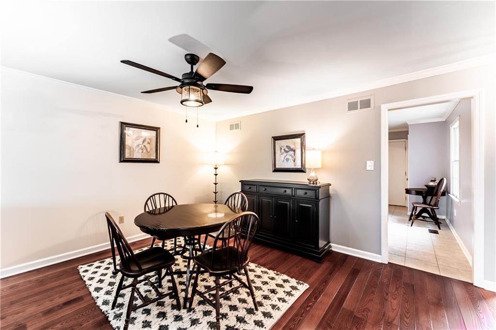 199 Roscommon Place Canonsburg, PA 15317 - Photo 4 of 32 a dining room with wooden floor a chandelier fan a wooden table and chairs