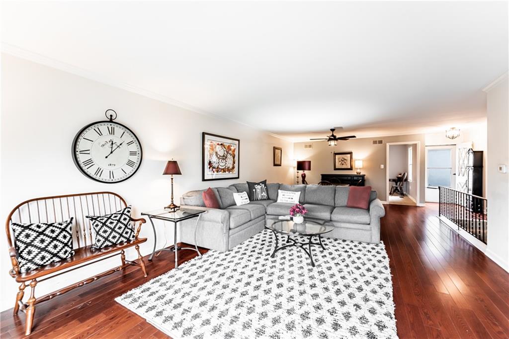 199 Roscommon Place Canonsburg, PA 15317 - Photo 5 of 32 a living room with furniture a rug and a clock