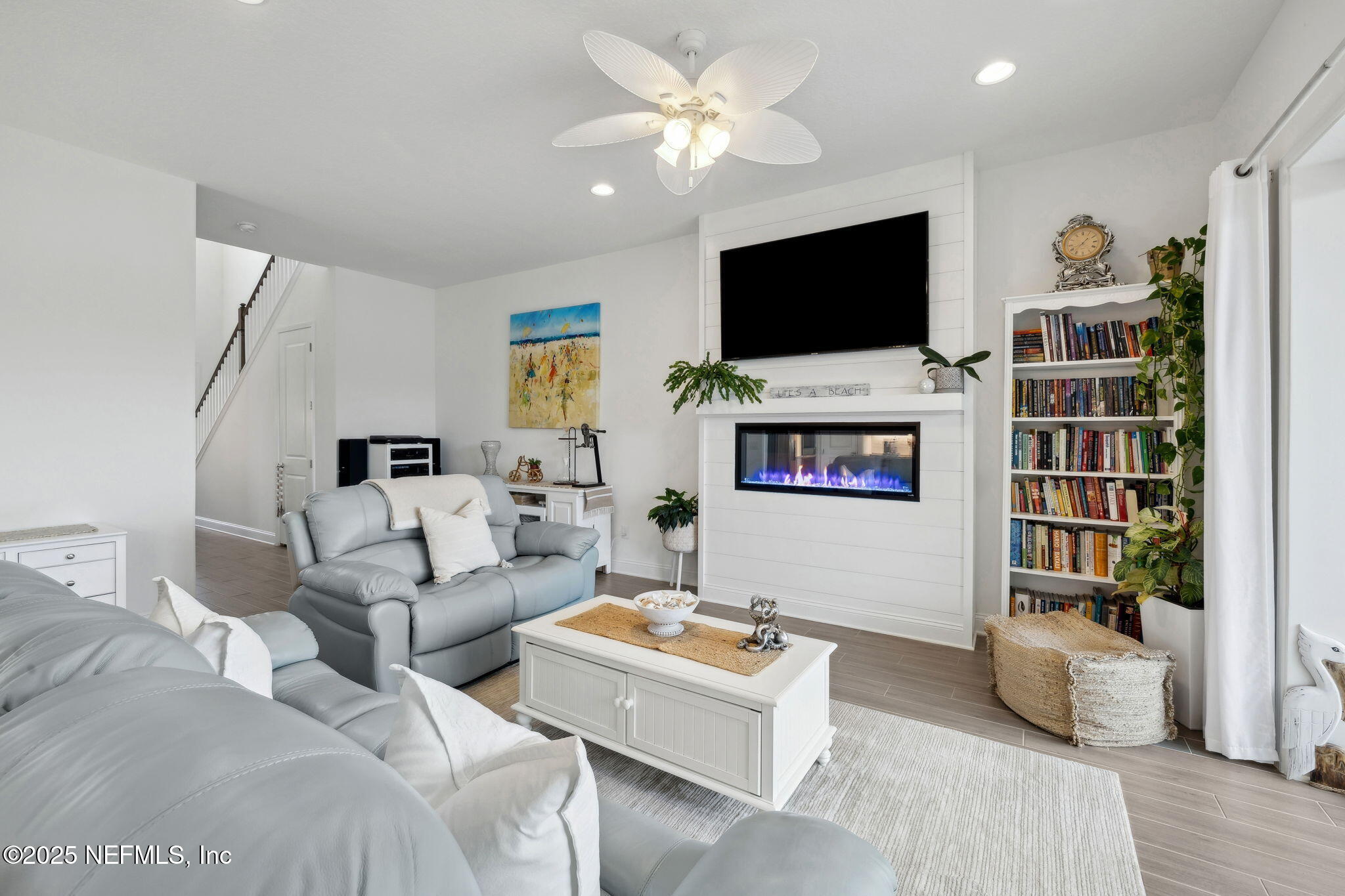 560 Rum Runner Way St. Johns, FL 32259 - Photo 11 of 101 a living room with furniture and a flat screen tv