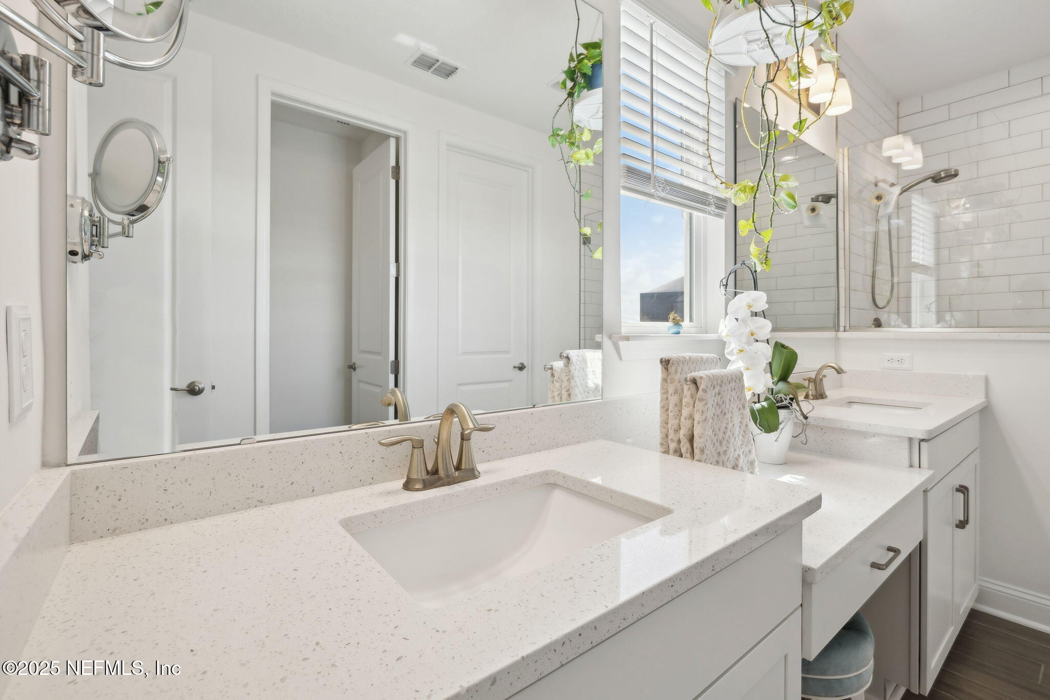 560 Rum Runner Way St. Johns, FL 32259 - Photo 27 of 101 a bathroom with a sink vanity and a mirror