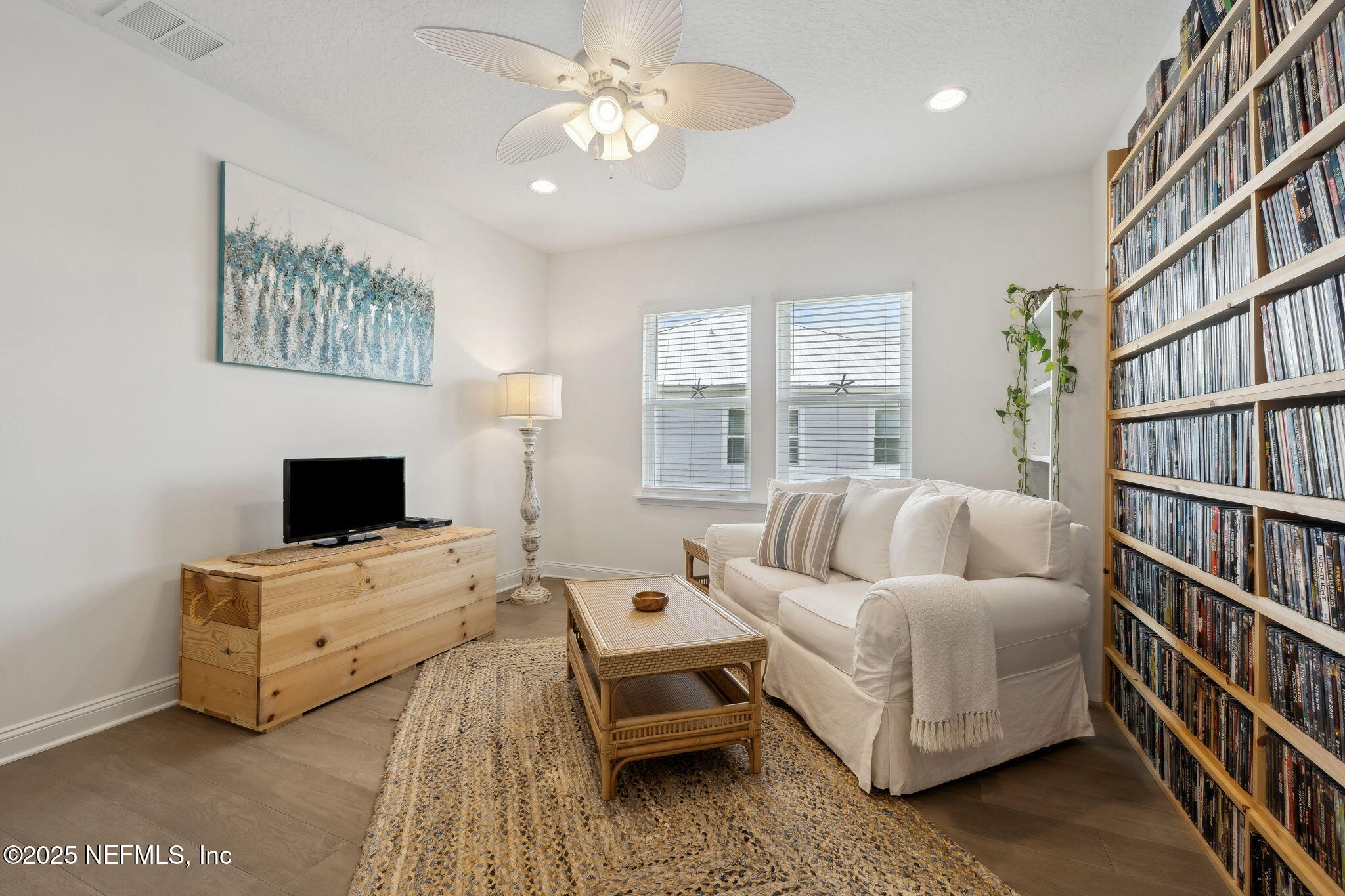 560 Rum Runner Way St. Johns, FL 32259 - Photo 33 of 101 a bedroom with a bed bookshelf and a window