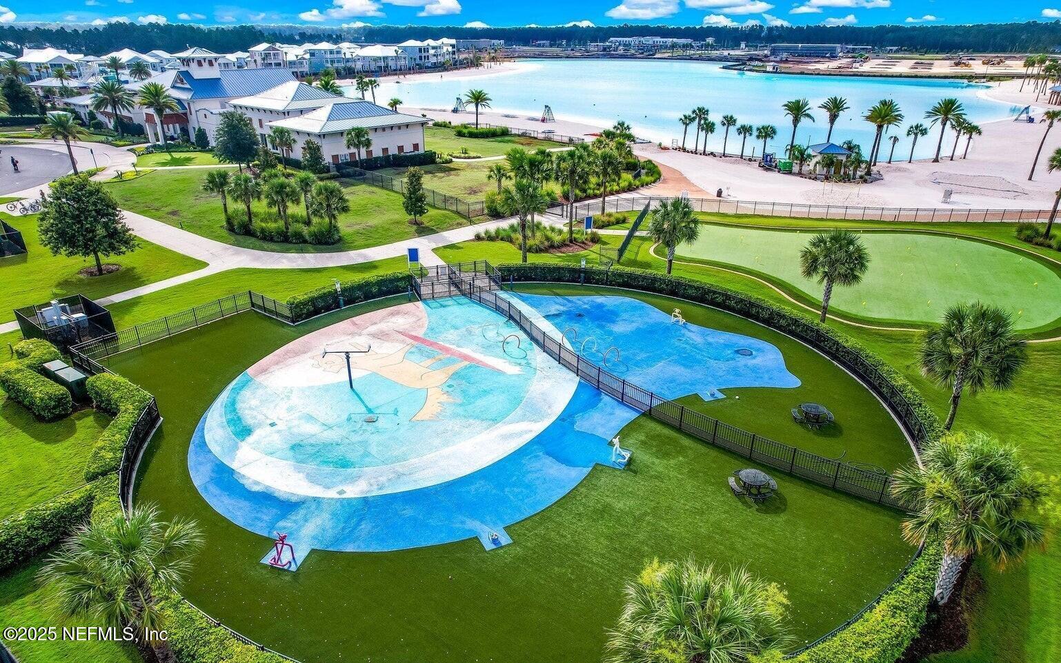 560 Rum Runner Way St. Johns, FL 32259 - Photo 91 of 101 an aerial view of a swimming pool patio and outdoor seating