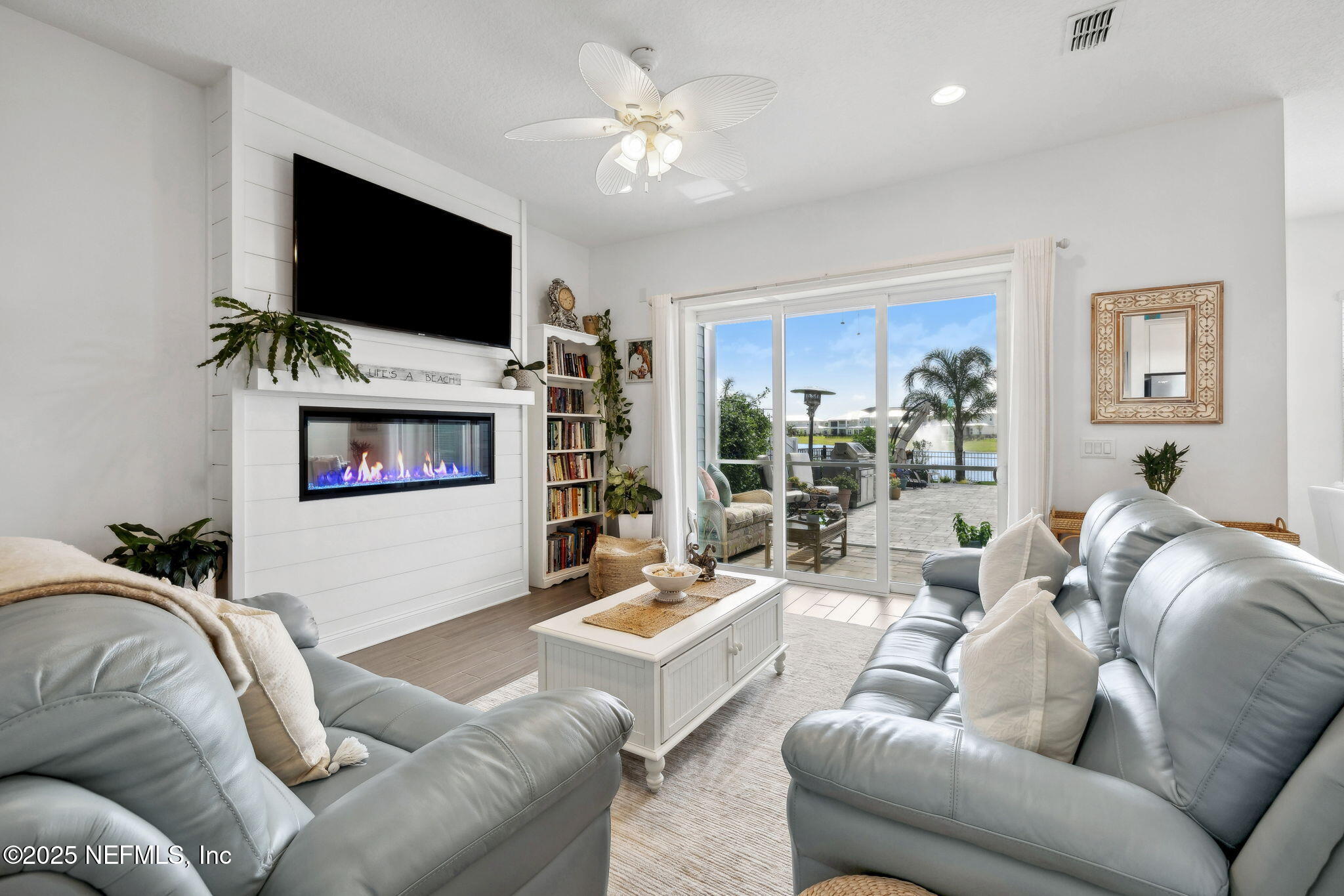 560 Rum Runner Way St. Johns, FL 32259 - Photo 10 of 101 a living room with furniture and a flat screen tv