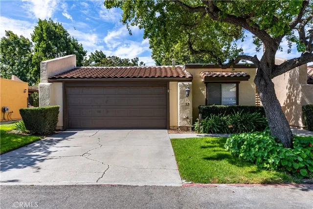 front view of a house with a garden