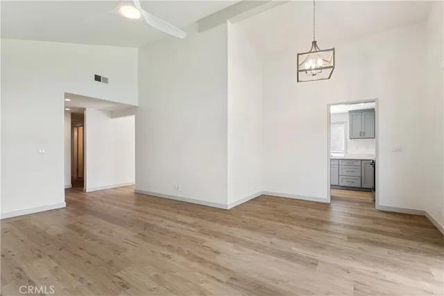 a view of a room with wooden floor garden view and a window