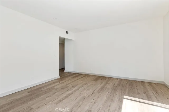 a kitchen with kitchen island granite countertop a sink appliances and cabinets