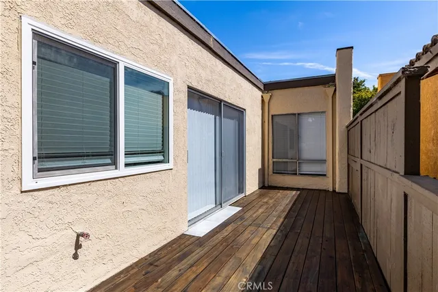 a view of a yard with plants and trees